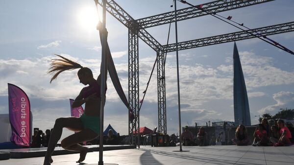 A girl dances Pole dance at the VK Fest festival in St. Petersburg