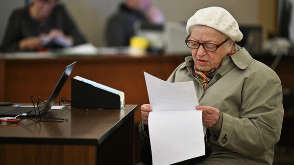 A voter examines the ballot at ballot box 2151 on voting day in the Moscow city council elections