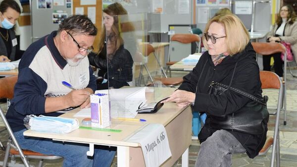 People register at a polling station in Vladimir for the election of the governor of the Vladimir region