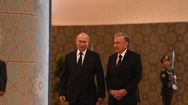 Президент России Владимир Путин и президент Узбекистана Шавкат Мирзиёев на саммите ШОС