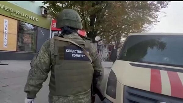 Следственные действия на месте обстрела в центре Донецка