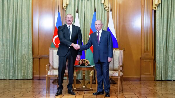 Президент России Владимир Путин и президент Азербайджана Ильхам Алиев во время встречи. 31 октября 2022