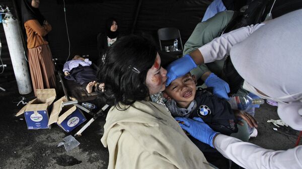 Earthquake victims receive medical treatment at a makeshift hospital in Chiangjur, West Java, Indonesia