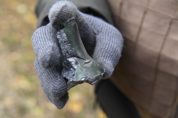 Фрагмент от разорвавшегося снаряда после недавних обстрелов со стороны ВСУ на территории Запорожской атомной электростанции
