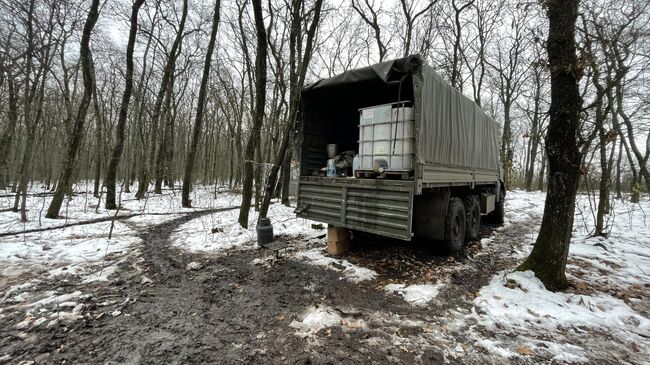 Армейский Камаз с баком с водой