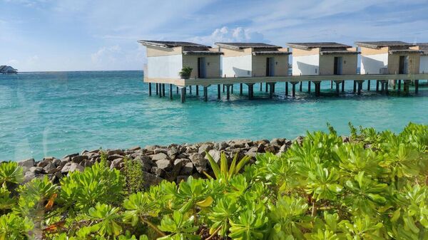 Виллы на воде в Hilton Maldives Amingiri Resort & SPA