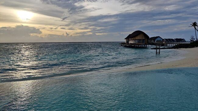 Закат в отеле Hilton Maldives Amingiri Resort & SPA