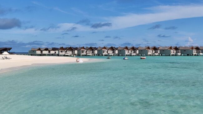 Водные виллы в отеле Movenpick Resort Kuredhivaru Maldives на Мальдивах