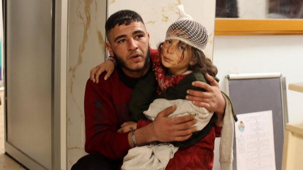 Пострадавшие при землетрясении в больнице Сирии