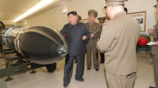 Лидер КНДР Ким Чен Ын во время принятия ядерного оружия на вооружение. 27 марта 2023