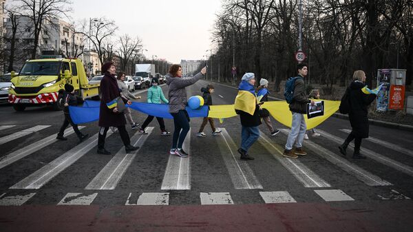 Украинские беженцы на улице Бухареста, Румыния