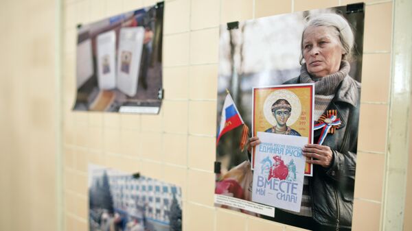 Открытие выставки фотокоров РИА Новости о Русской весне в Луганске 