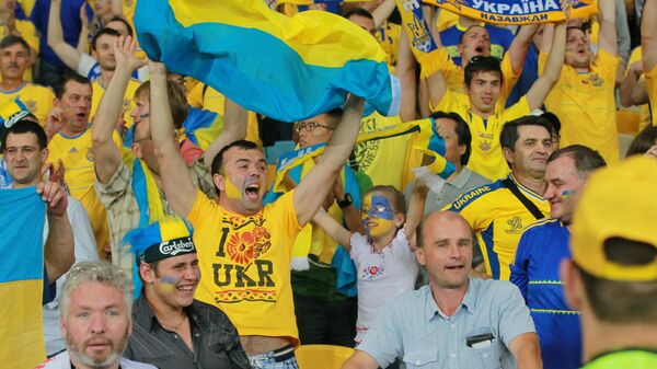 Болельщики сборной Украины на трибуне стадиона НСК Олимпийский
