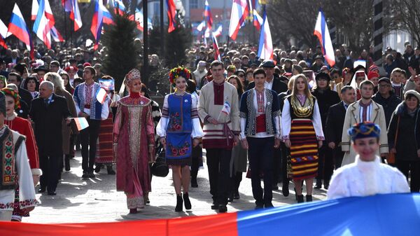 Праздничное шествие во время мероприятий, посвященных 5-й годовщине Общекрымского референдума 2014 года и воссоединения Крыма с Россией, в Симферополе. 15 марта 2019