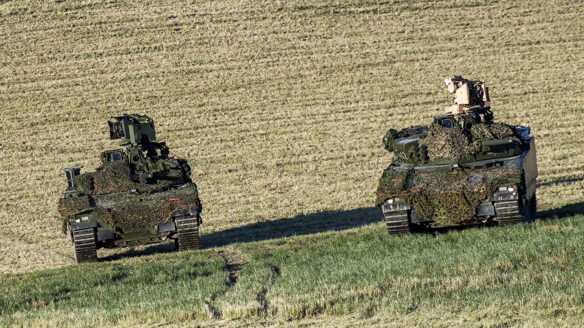 Танки норвежских и немецких войск во время учений НАТО Trident Juncture — 2018 в Норвегии - РИА Новости, 1920, 11.05.2023