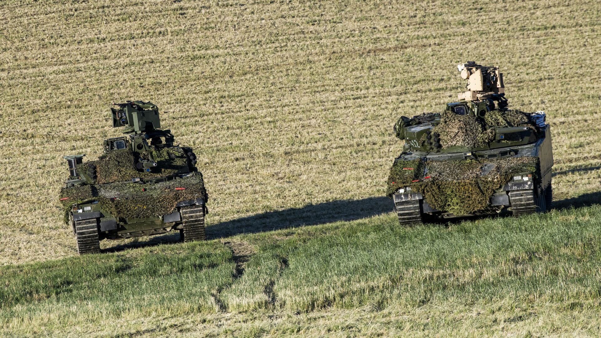 Танки норвежских и немецких войск во время учений НАТО Trident Juncture — 2018 в Норвегии - РИА Новости, 1920, 11.05.2023
