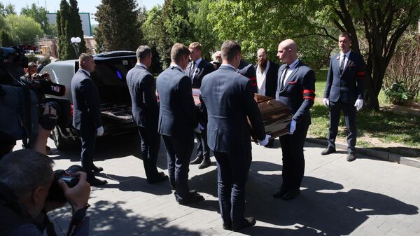 The removal of the coffin with the body of Eduard Sagalaev, head of the National Broadcasters Union, after the farewell ceremony at the Troyekurovo funeral home