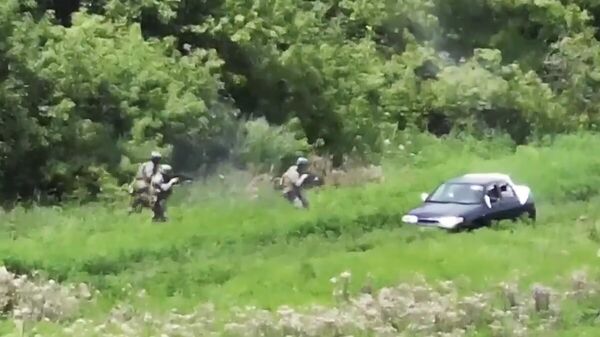 Кадр видео расстрела мирных жителей украинскими военными
