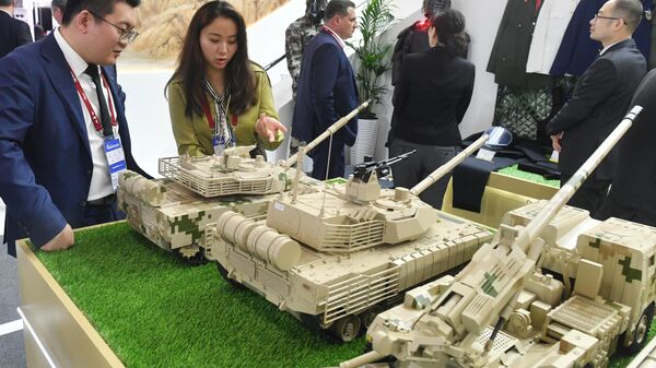 Models of military equipment and weapons at the booth of the Chinese Ministry of Defense at the exhibition as part of the Army-2023 International Military-Technical Forum at the Patriot Convention and Exhibition Center