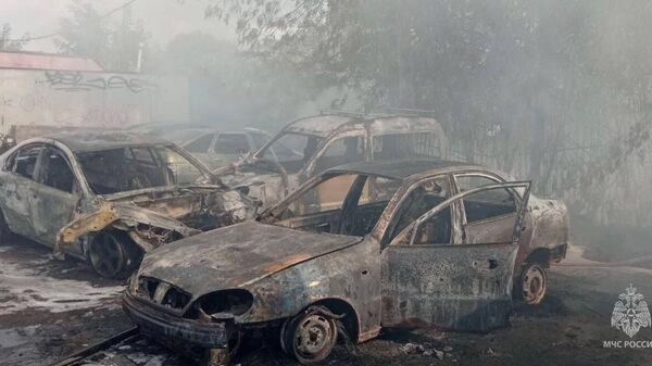 Последствия пожара на автостоянке в Подольске