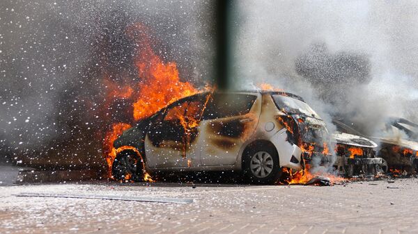 A burning car in Ashkelon after a rocket attack from the Gaza Strip