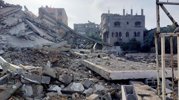 Обломки зданий, пострадавших в результате ракетных ударов ВС Израиля по Газе. Архивное фото