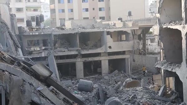 Последствия удара Израиля по жилому дому в Газе