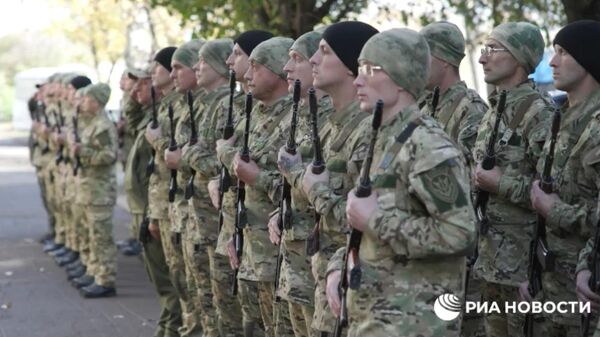 Бойцы батальона имени Богдана Хмельницкого, первого подразделения, состоящего из бывших украинских военнопленных, принесли присягу России