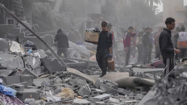 Разрушения в городе Дейр-эль-Балах в Газе