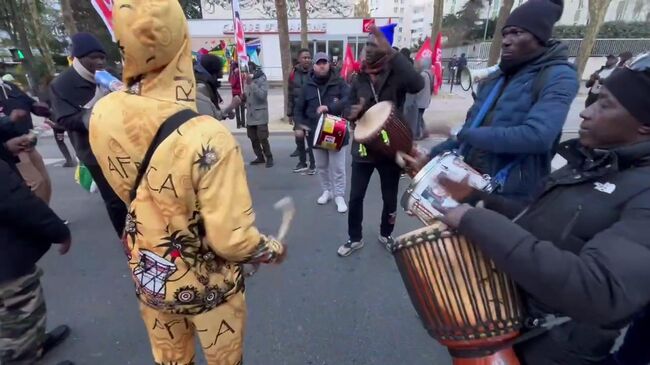 Акция в Париже против ужесточения иммиграционных законов