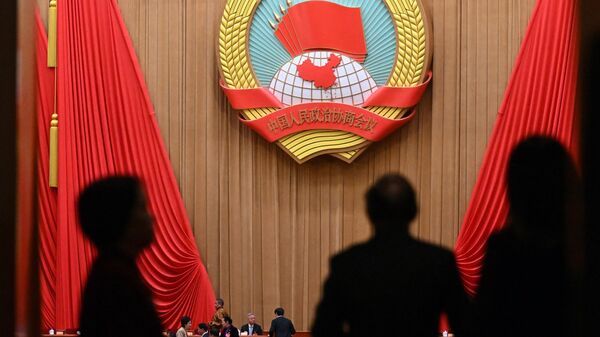 Делегаты прибывают на церемонию открытия сессии Народного политического консультативного совета Китая в Доме народных собраний в Пекине