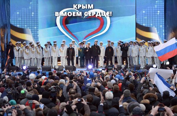 Президент России Владимир Путин во время выступления на митинг-концерте Мы вместе! на Красной площади в Москве.