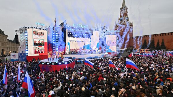 Зрители и участники митинг-концерта на Красной площади в Москве, посвященного десятилетию воссоединения Крыма с Россией. 18 марта 2024
