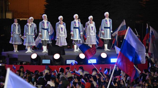 Артисты выступают на митинг-концерте на Красной площади в Москве, посвященном десятилетию воссоединения Крыма с Россией