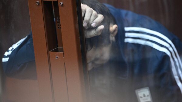 Далержон Мирзоев, задержанный по подозрению в террористическом акте в Крокус Сити Холл, в здании Басманного суда Москвы, где проходит избрание меры пресечения в отношении четырех задержанных подозреваемых. Архивное фото