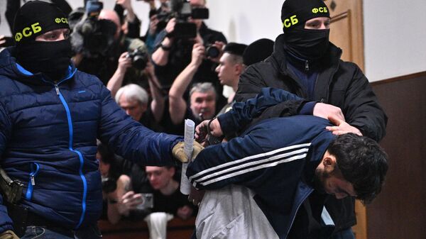 Далержон Мирзоев, задержанный по подозрению в террористическом акте в Крокус Сити Холл, в здании Басманного суда Москвы
