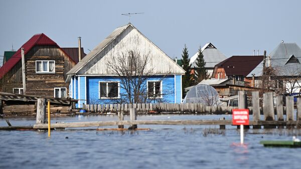 Жилые дома, затопленные в результате паводка