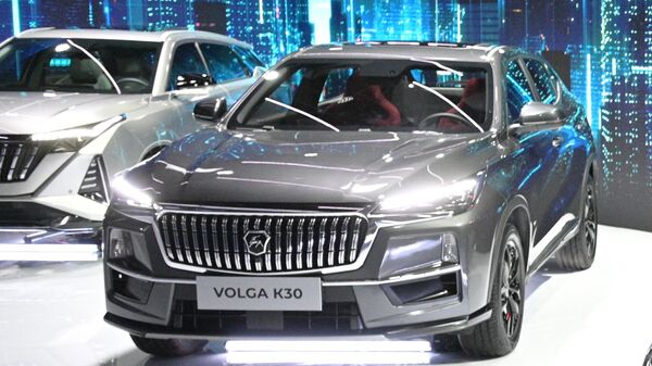 Новый автомобиль Volga К30 в павильоне марки VOLGA на выставке IX конференции Цифровая индустрия промышленной России в Нижнем Новгороде