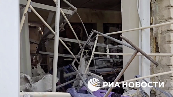Последствия ракетного удара ВСУ по многоквартирному дому в Луганске