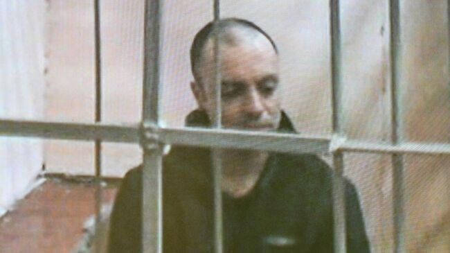 Гражданин России и Италии Руслан Сидики в режиме видеотрансляции на заседании во Втором Западном окружном военном суде в Москве