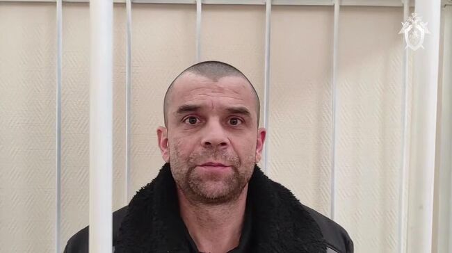 Украинский военнослужащий Борис Николенко, запугивавший мирных жителей Курской области, в суде. Кадр видео