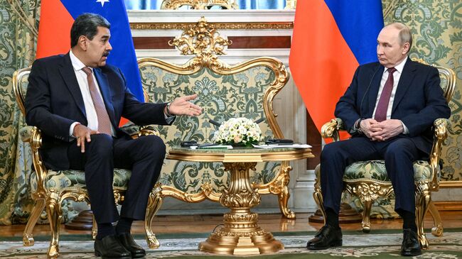 Президент РФ Владимир Путин и президент Венесуэлы Николас Мадуро во время встречи