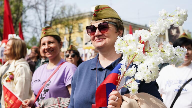 Участница акции Бессмертный полк во время празднования 80-летия Победы в Великой Отечественной войне в Кемерово Участница акции Бессмертный полк во время празднования 80-летия Победы в Великой Отечественной войне в Кемерово