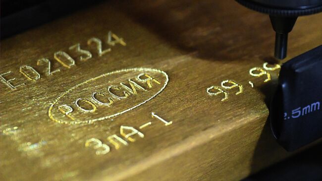 Маркировка золотого слитка высшей пробы