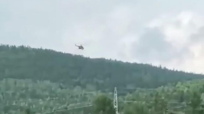 Вертолет МЧС в районе исчезновения самолета Ан-24 в Амурской области