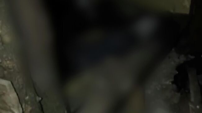 Тело замученного боевиками киевского режима мирного жителя ДНР