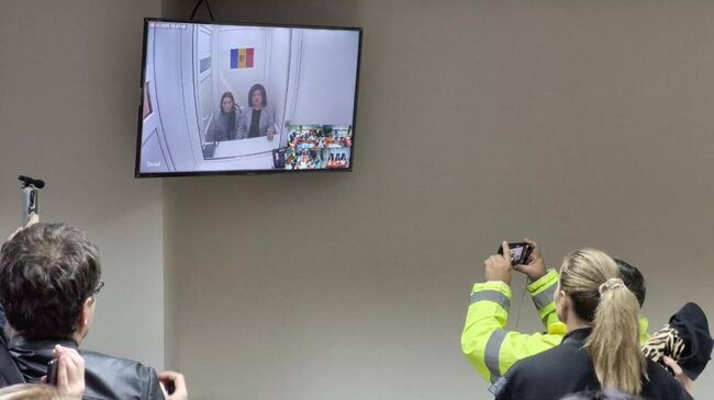 Подключение по видеосвязи Евгении Гуцул и Светланы Попан в зале суда Подключение по видеосвязи Евгении Гуцул и Светланы Попан в зале суда