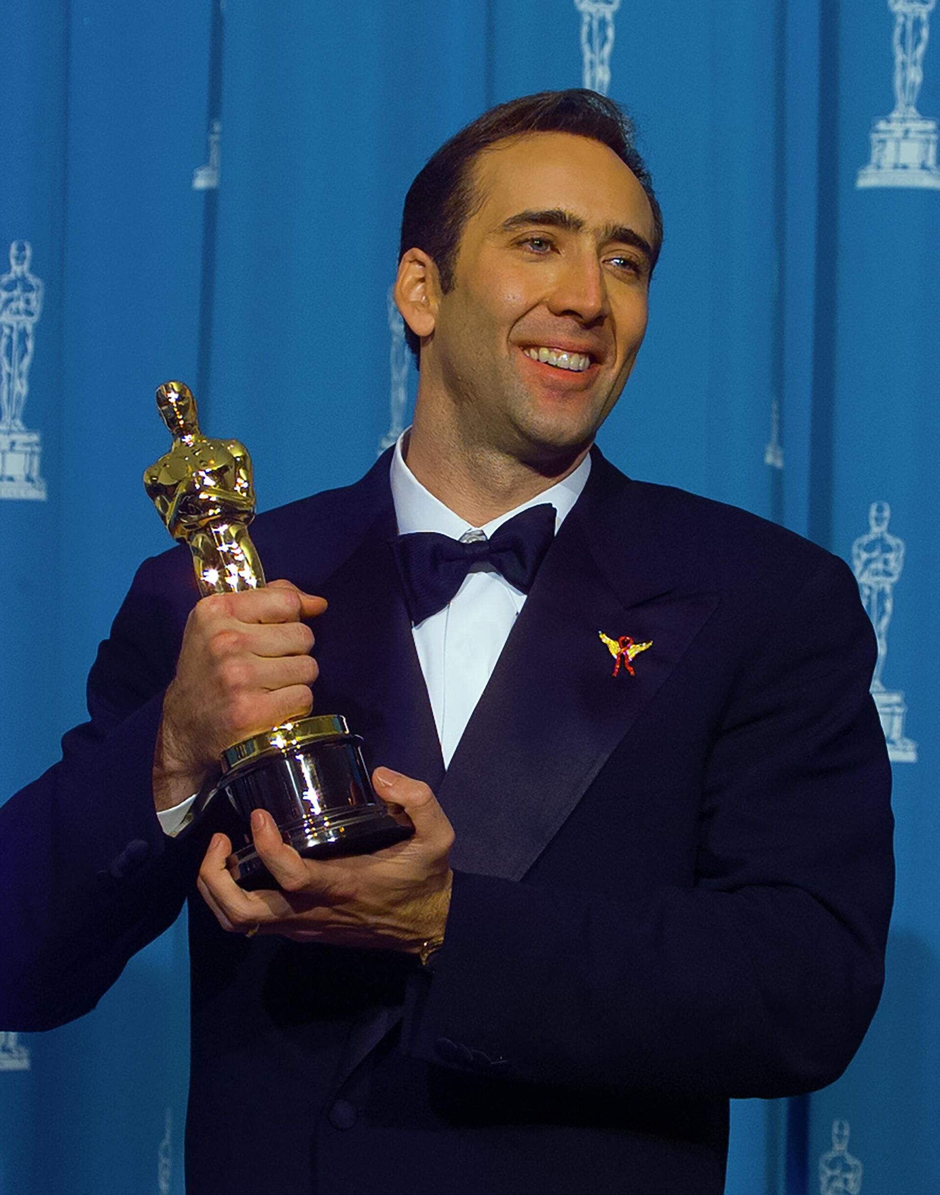 Обладатель приза киноакадемии Оскар Николас Кейдж на церемонии награждения, 1996 год Обладатель приза киноакадемии Оскар Николас Кейдж на церемонии награждения, 1996 год - РИА Новости, 1920, 27.10.2025