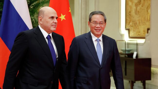 Председатель правительства РФ Михаил Мишустин и премьер Государственного совета Китая Ли Цян во время встречи в Ханчжоу