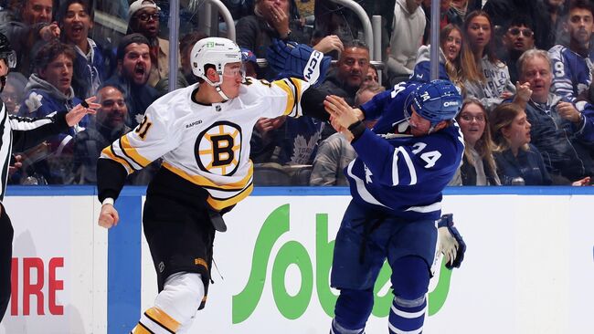 Хоккеист Бостон Брюинз Никита Задоров (слева) Хоккеист Бостон Брюинз Никита Задоров (слева)